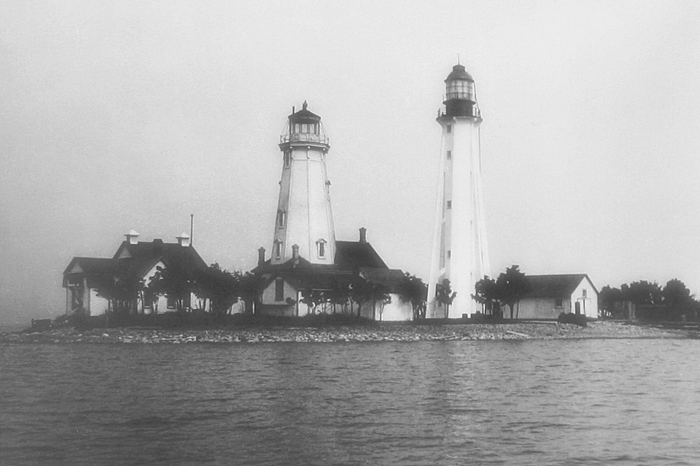 A photo of the old and new lighthouses at Caribou Island in 1911. Photo credit: Canadian Coast Guard.